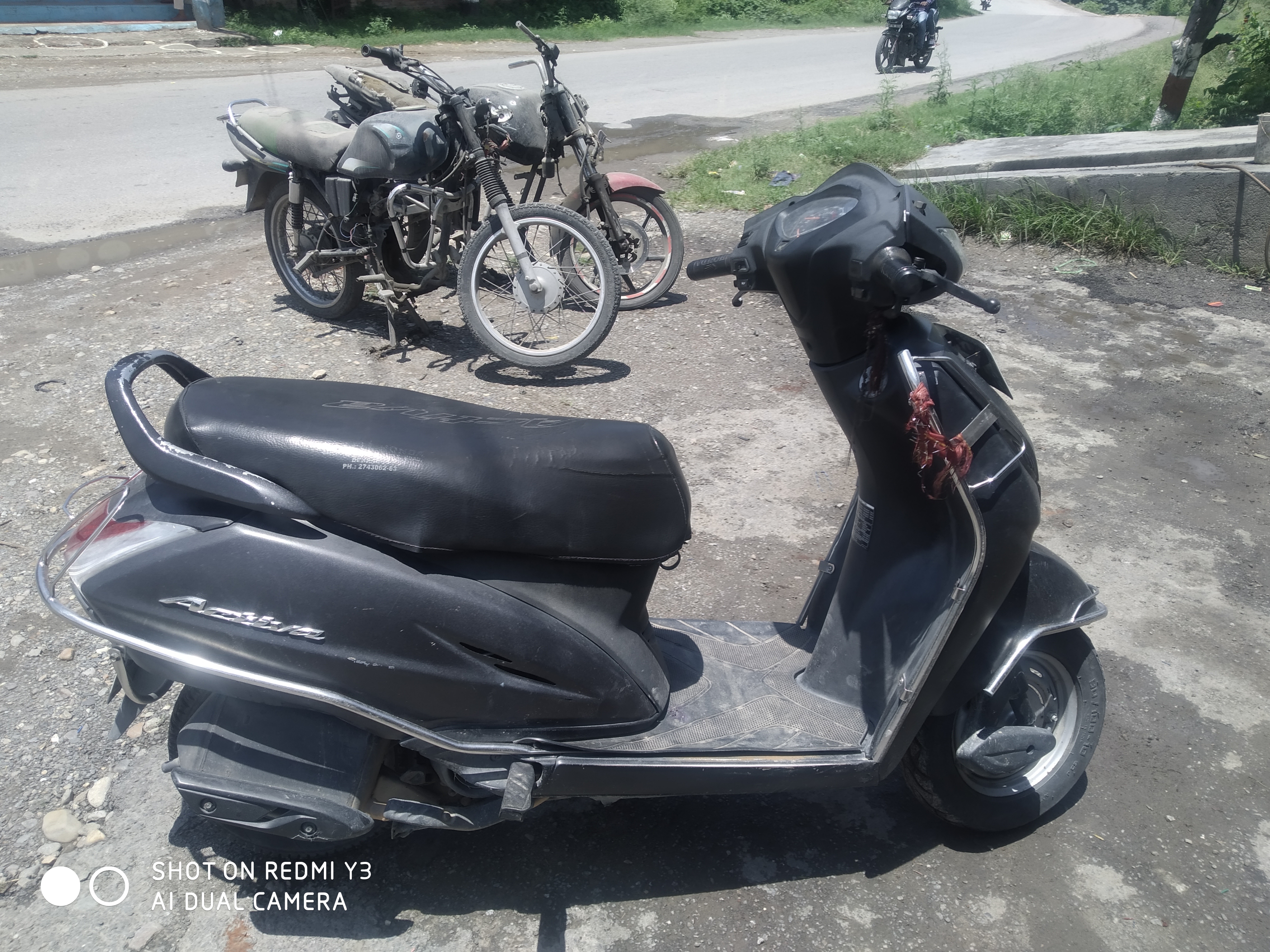 Honda activa 4g discount price on road